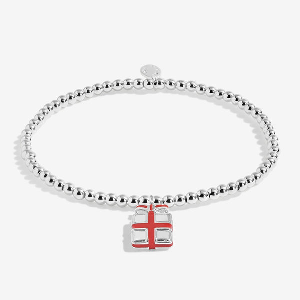 Shop Joma Jewellery’s Kids Love From Santa ‘Happy Christmas’ Bracelet. Silver-plated with present charm, perfect Christmas gift for children with gift bag