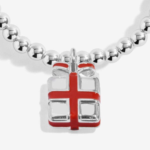 Shop Joma Jewellery’s Kids Love From Santa ‘Happy Christmas’ Bracelet. Silver-plated with present charm, perfect Christmas gift for children with gift bag