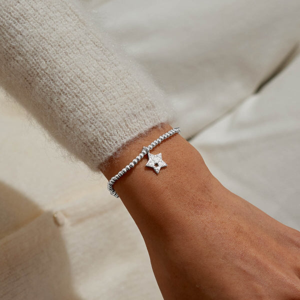 Shop the Joma Jewellery Christmas A Little ‘Christmas Wishes’ Bracelet. Silver-plated with a star charm.