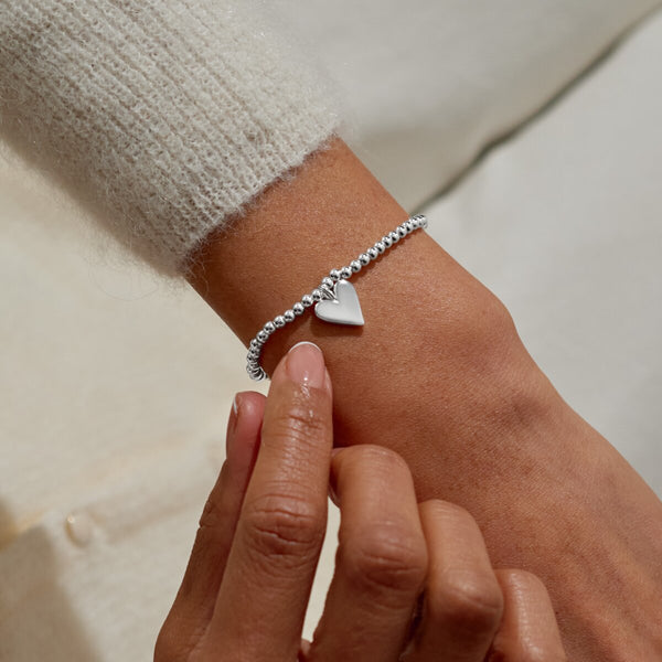 Shop Joma Jewellery’s Adults Stocking ‘A Little Merry Christmas’ Bracelet Gift Set. Silver-plated with heart charm, festive gift ready in a velvet star-print stocking, perfect for Christmas