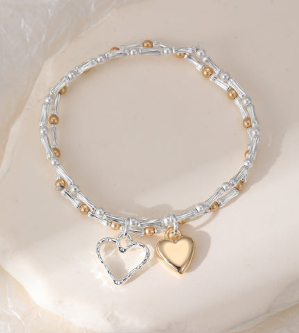 Silver and gold plated hearts on a double layer stretch bracelet stack