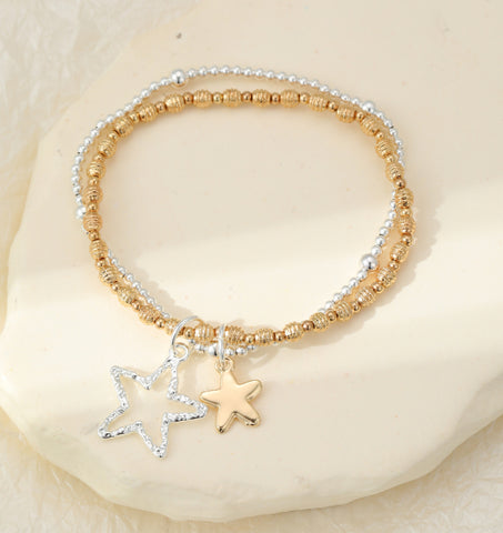 Silver and gold plated star charms on double layer bracelet stack with stretch