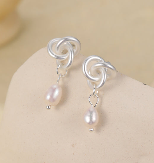 Silver plated earrings with silver knot and pearl drops
