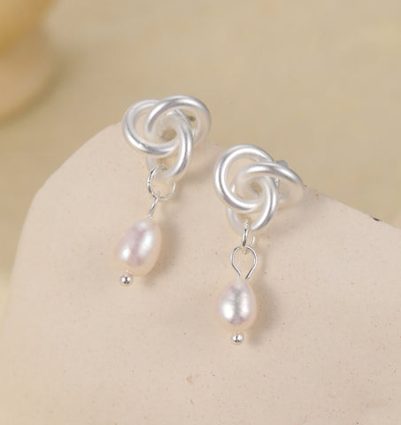 Silver plated earrings with silver knot and pearl drops