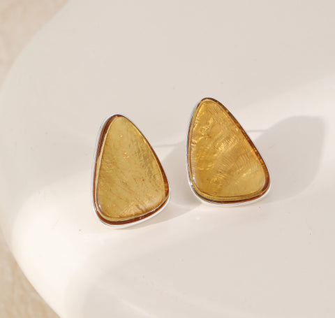 Pair of amber teardrop-shaped earrings on a stud post