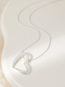 Heart-shaped silver plated pendant on an adjustable chain