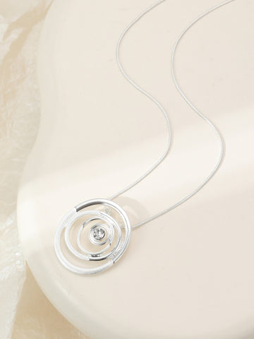 Silver plated necklace with a circular swirl pendant on an adjustable chain