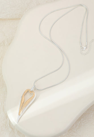 Long necklace with a gold and silver plated heart pendant
