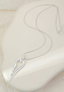 Silver plated heart-shaped pendant on a long adjustable chain