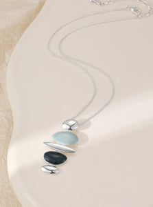 Silver plated necklace with a unique blue tone pendant
